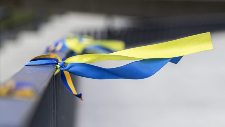 Ribbons in the colors of the national flag of Ukraine are tied to the handrail. Yellow-blue tapes.